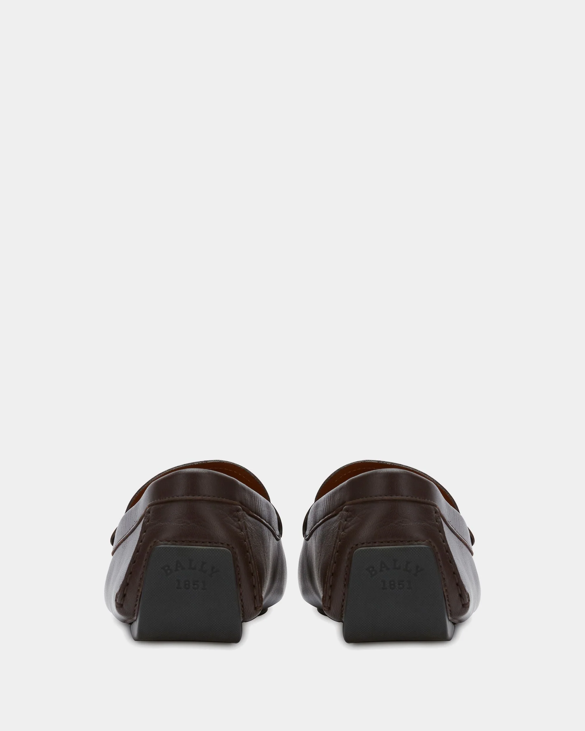 Driver in Brown Leather - Image 2