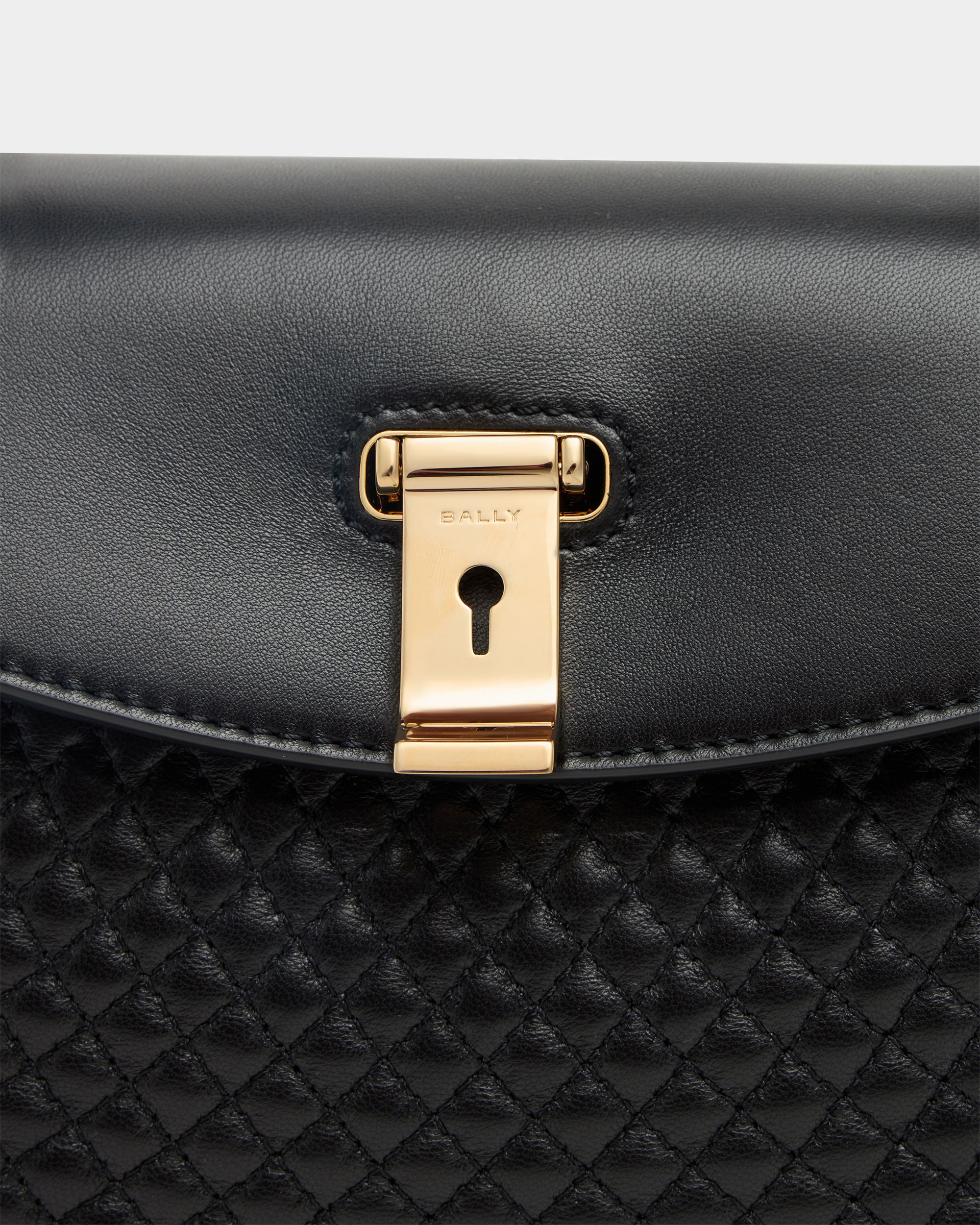 Lock Me Small Top Handle Bag In Black Quilted Leather - Image 5