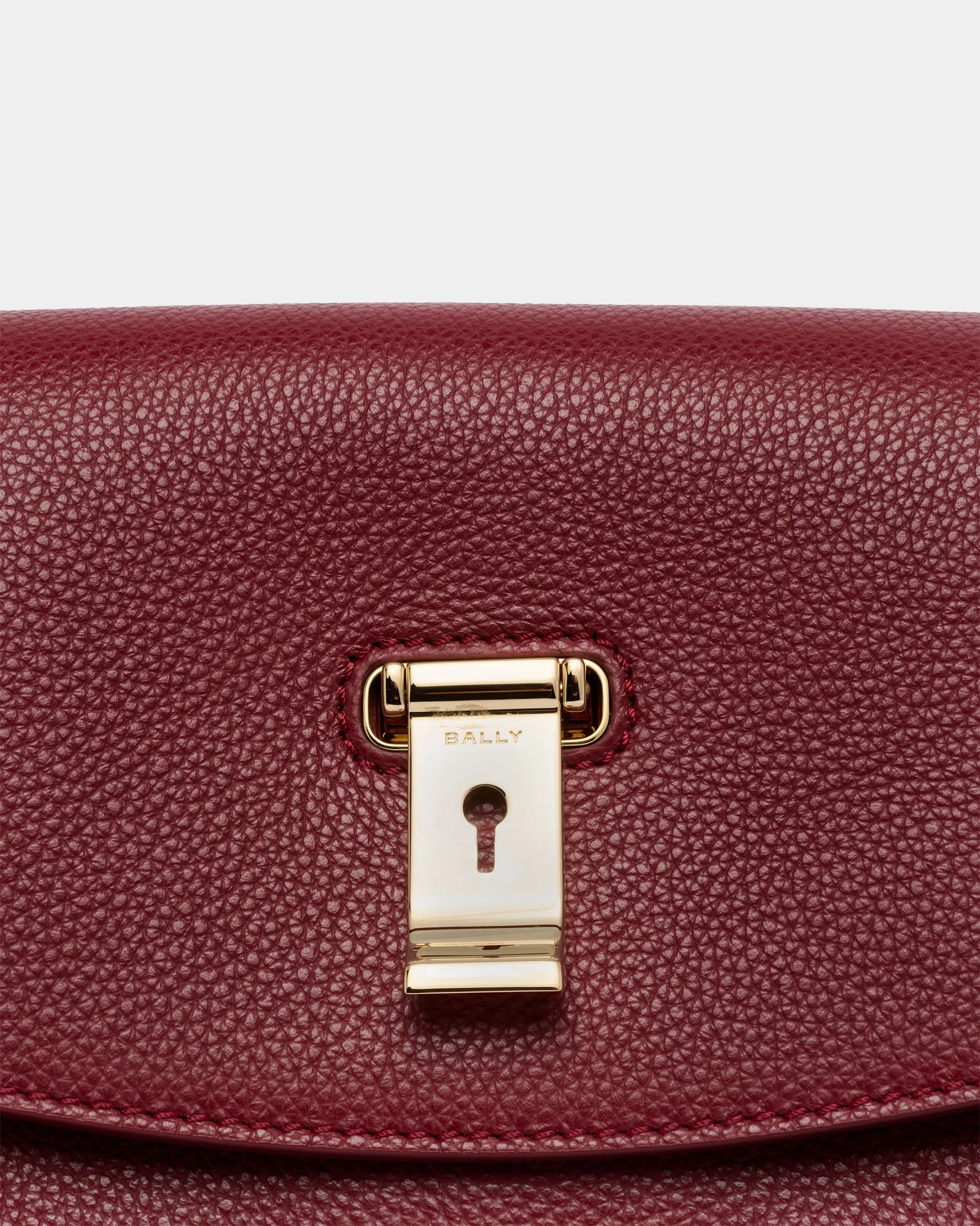 Lock Me Top Handle Bag in Ruby Red Grained Leather - Image 5