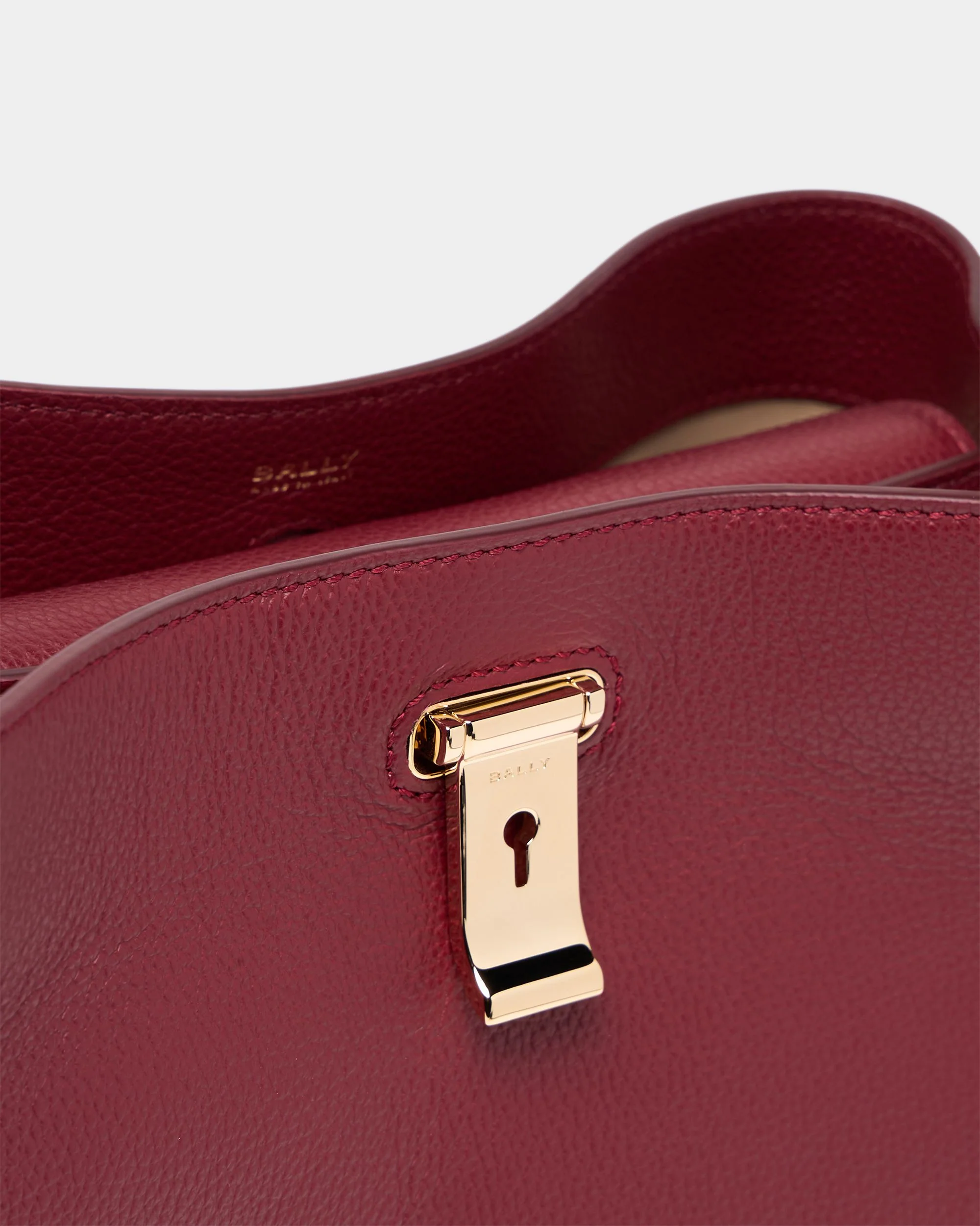 Lock Me Top Handle Bag in Ruby Red Grained Leather - Image 6